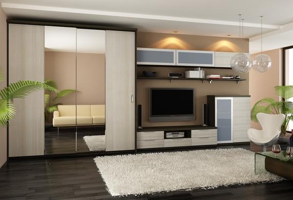 Выбирать шкаф-купе, который бы органично дополнял дизайн гостиной, необходимо с учетом интерьера и особенностей комнаты