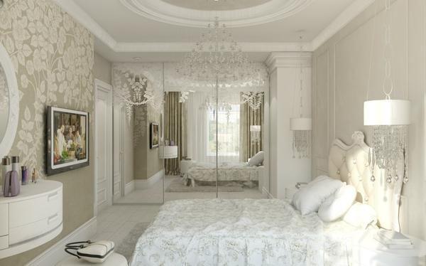 Спальня в белых тонах выглядит изысканно и элегантно