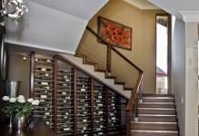 modern-dark-finish-pine-wine-cellar-under-quarter-landing-staircase