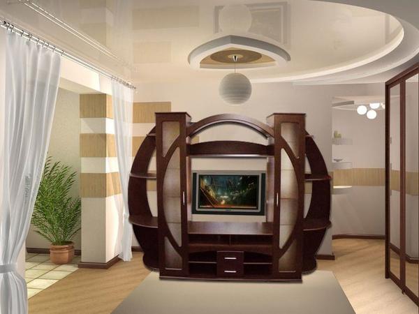 Круглая стенка в гостиной не только смотрится оригинально, но и довольно практична