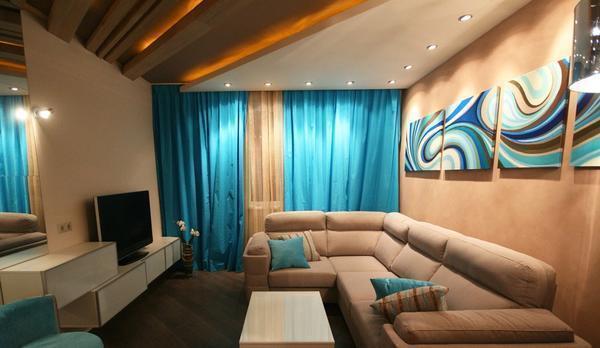 Дополнительно украсить гостевую комнаты можно угловым диваном и модульными картинами