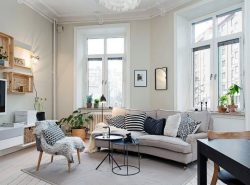 Сделать гостиную современной и стильной можно при помощи оформления комнаты в скандинавском стиле